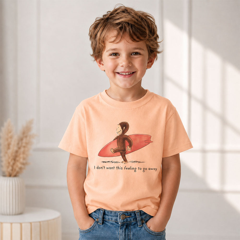 Curious Surfer Monkey Shirt Nostalgic Summer Beach Graphic Tee worn by a smiling boy with a surfboard.