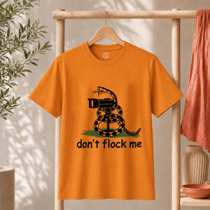 Dont Flock Me Snake With Camera T Shirt Surveillance Tee on an orange shirt with a humorous snake design.