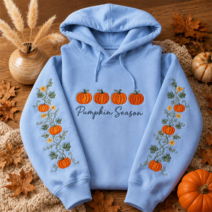 Pumpkin Season Embroidered Hoodie featuring colorful pumpkins and floral design on a light blue background.