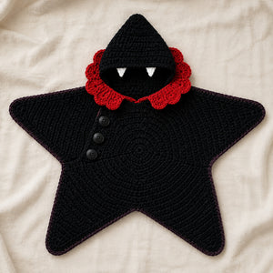 Black vampire crochet star baby blanket with red collar and fang hood.