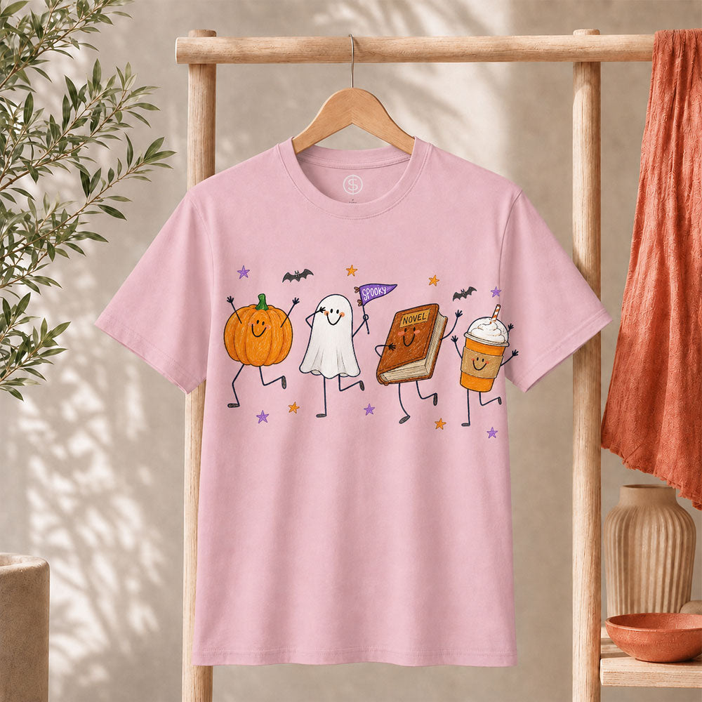 Cute Halloween Doodles Shirt featuring playful pumpkin, ghost, and drink illustrations on a pink tee.