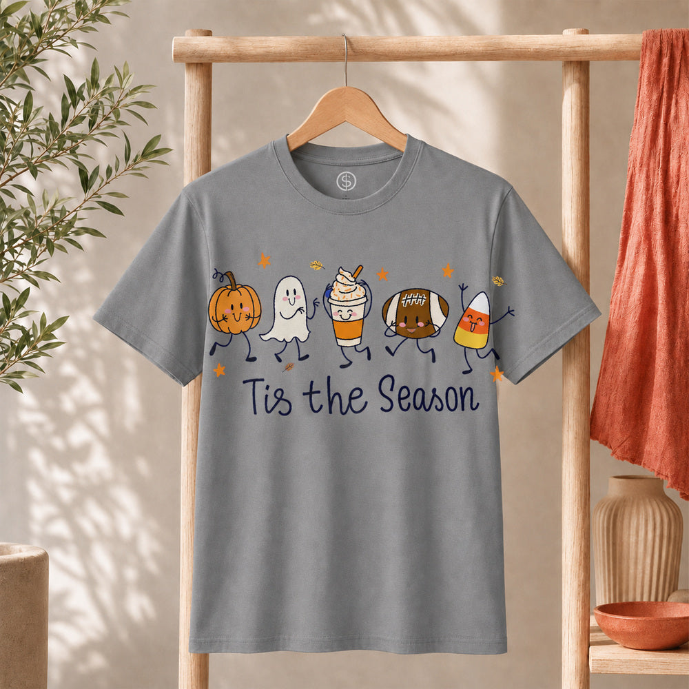 Cute Halloween Pumpkin Ghost Football Coffee Candy Corn Shirt displayed on a hanger with fun fall graphics.