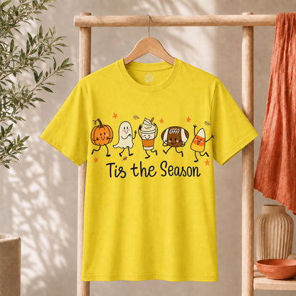Cute Halloween Pumpkin Ghost Football Coffee Candy Corn Shirt displayed on a yellow t-shirt, celebrating the spooky season.