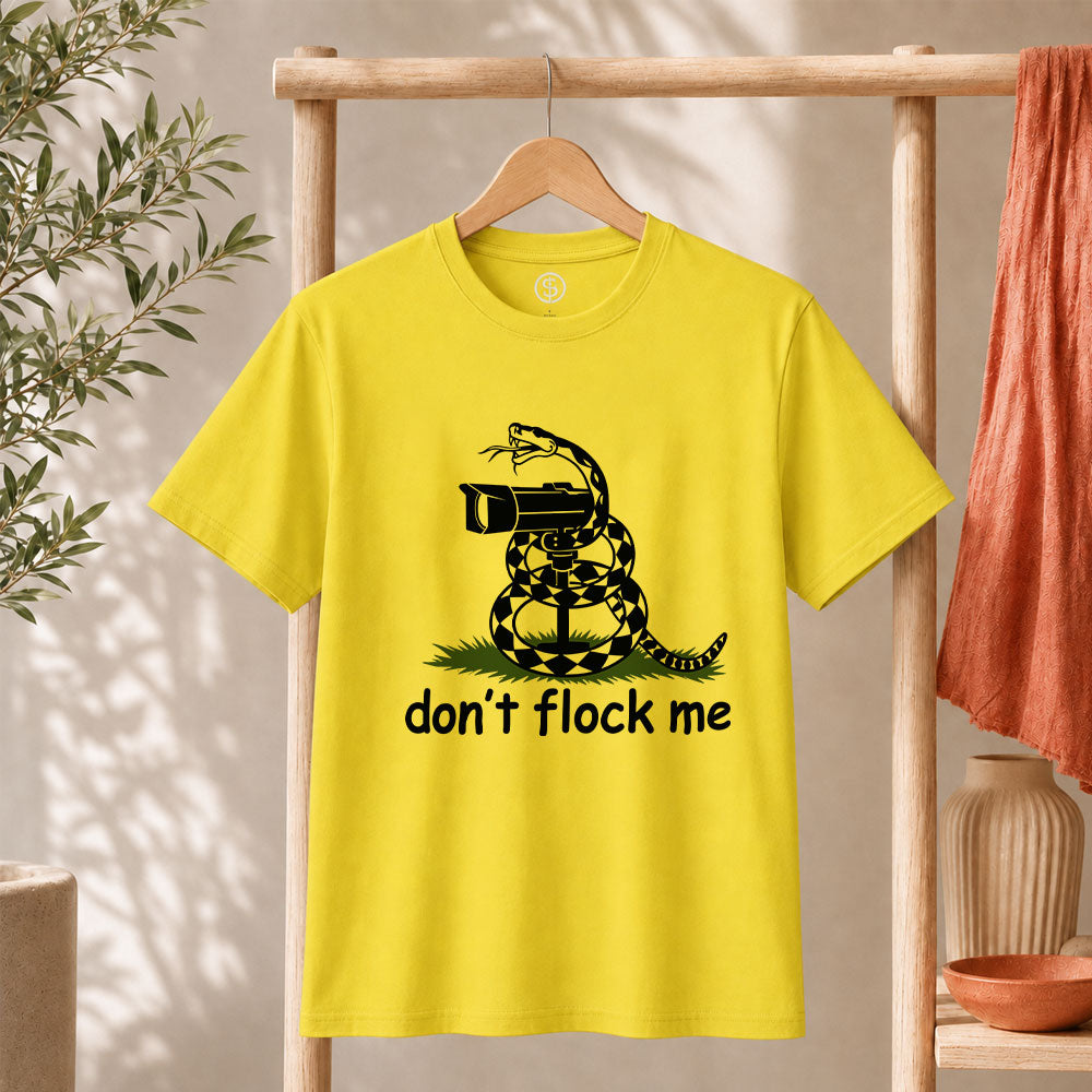 Dont Flock Me Snake With Camera T Shirt Surveillance Tee featuring a humorous snake and camera design on a yellow shirt.