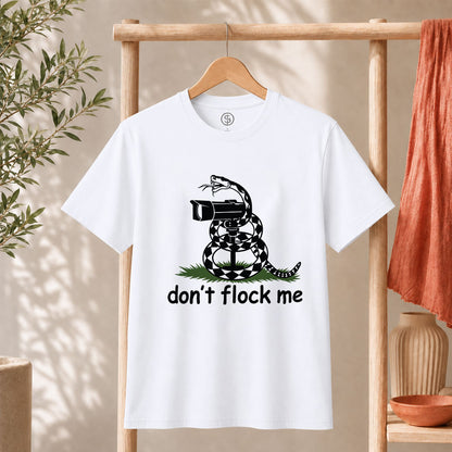Dont Flock Me Snake With Camera T Shirt displayed on a hanger with a humorous snake design.