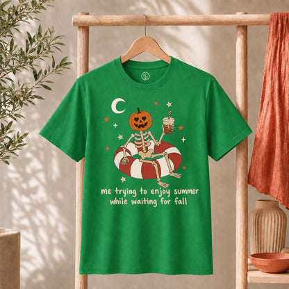 Me Trying to Enjoy Summer While Waiting for Fall Tee featuring a skeleton with pumpkin head on a pool float.