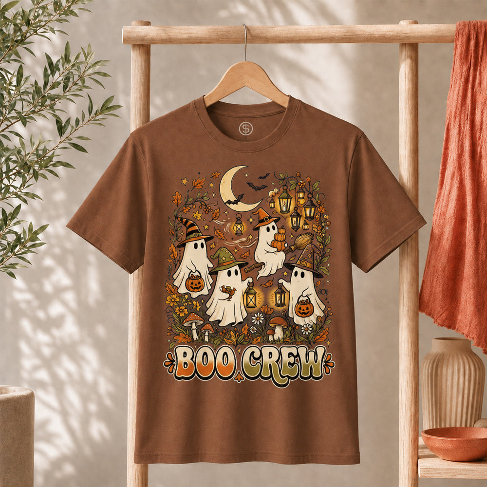 Retro Boo Crew Ghost Vintage Halloween T-Shirt featuring friendly ghosts, pumpkins, and autumn leaves on a brown shirt.