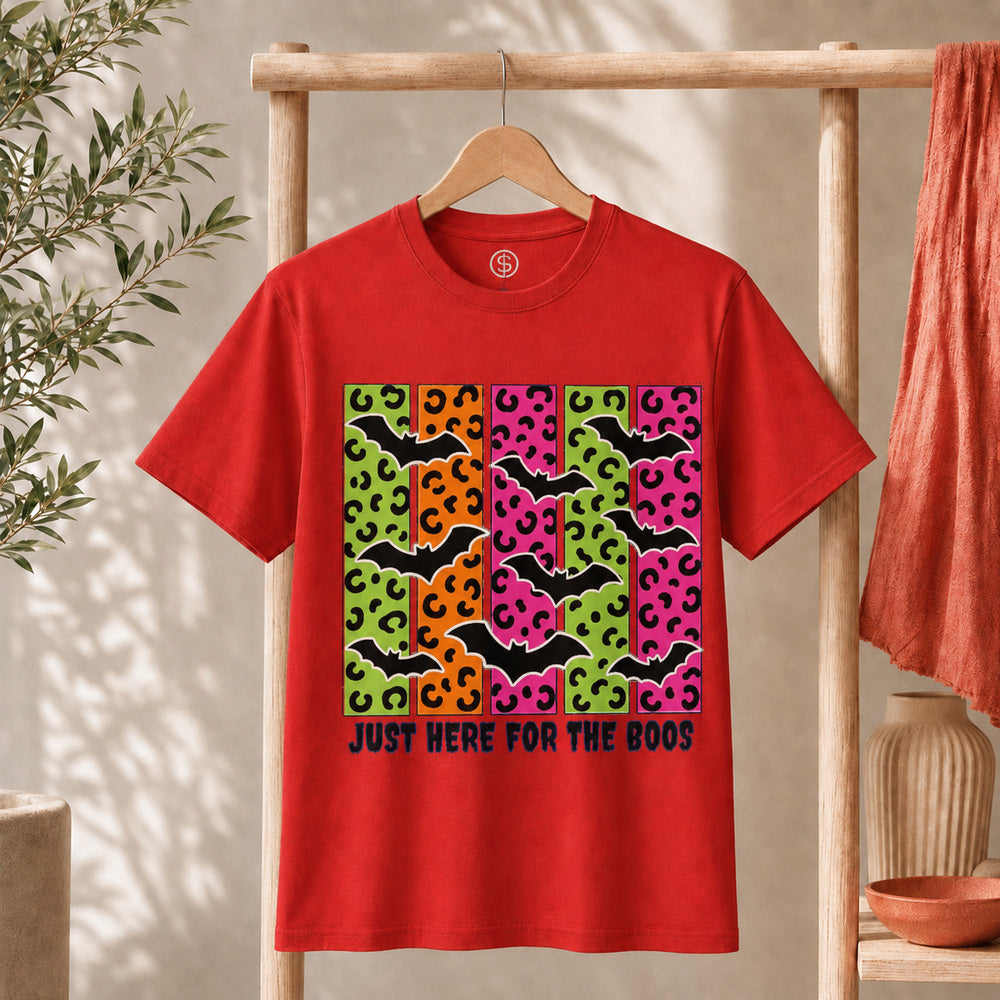 Spooky Bats Graphic Tee featuring colorful bats and the phrase "Just Here for the Boos" on a red shirt.