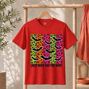 Spooky Bats Graphic Tee featuring colorful bats and the phrase "Just Here for the Boos" on a red shirt.