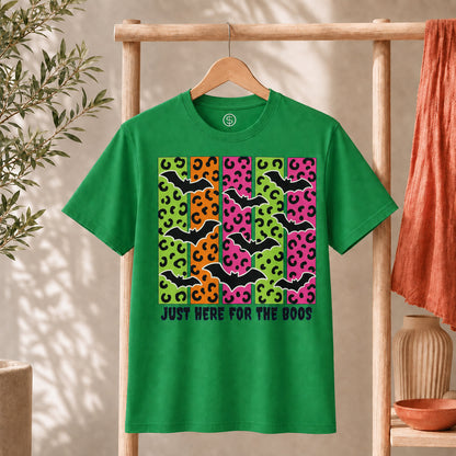 Spooky Bats Graphic Tee features colorful bats and the phrase 'Just Here for the Boos' on a green T-shirt.
