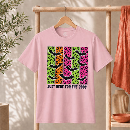 Spooky Bats Graphic Tee featuring colorful bats and the phrase 'Just Here for the Boos' on a pink t-shirt.