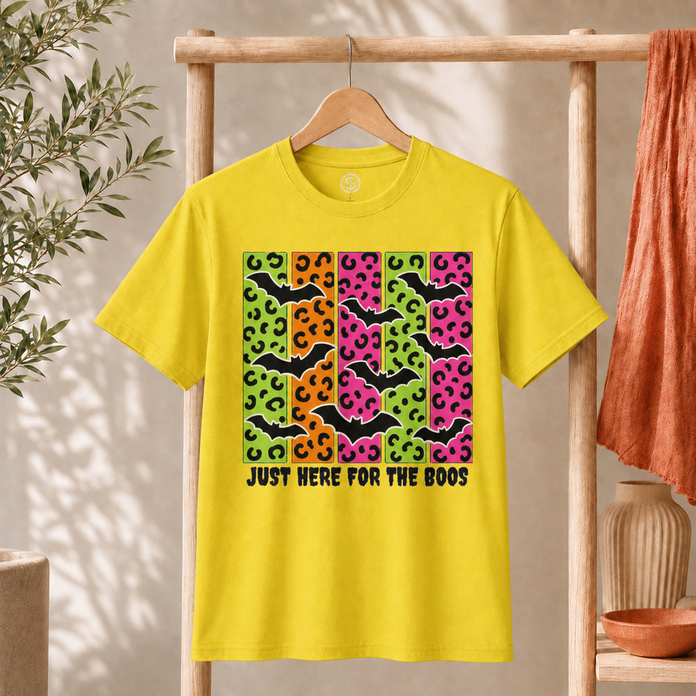 Spooky Bats Graphic Tee featuring colorful bats and the phrase 'Just Here for the Boos' on a yellow shirt.